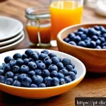 Home 22 우울증 전문의가 추천하는 음식 리스트 - A vibrant, detailed breakfast scene featuring a rustic wooden table with a bowl of fresh blueberries...